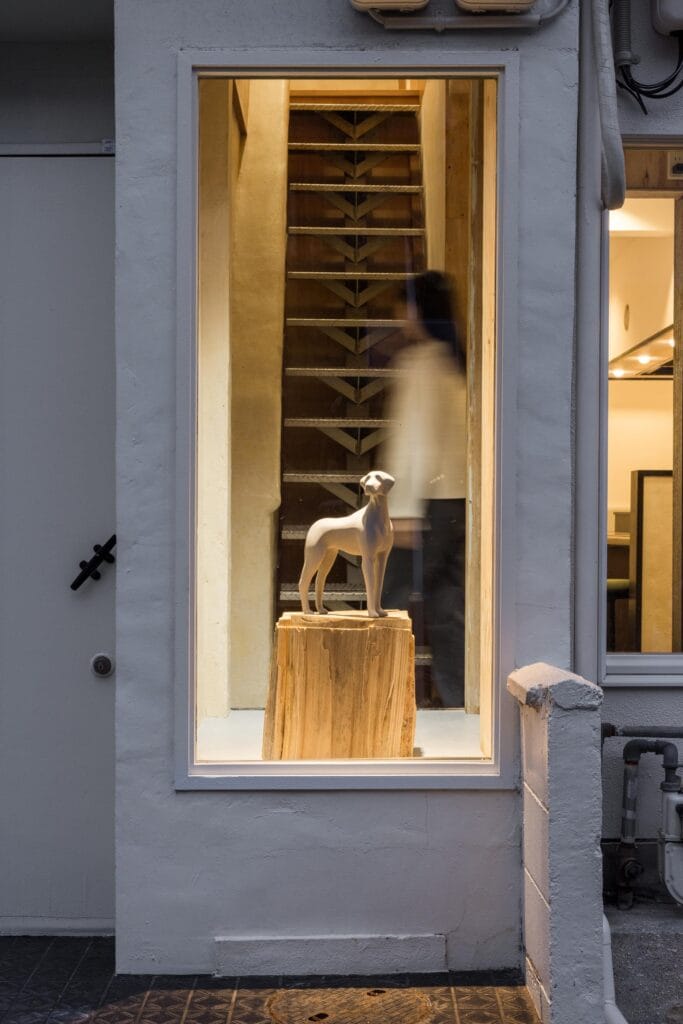 Metal staircase viewed through glass